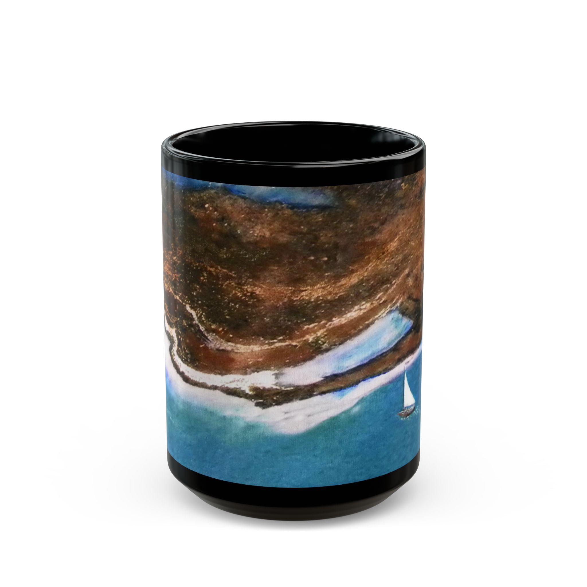 Black mug with a scenic design of sailboats on water and mountains.