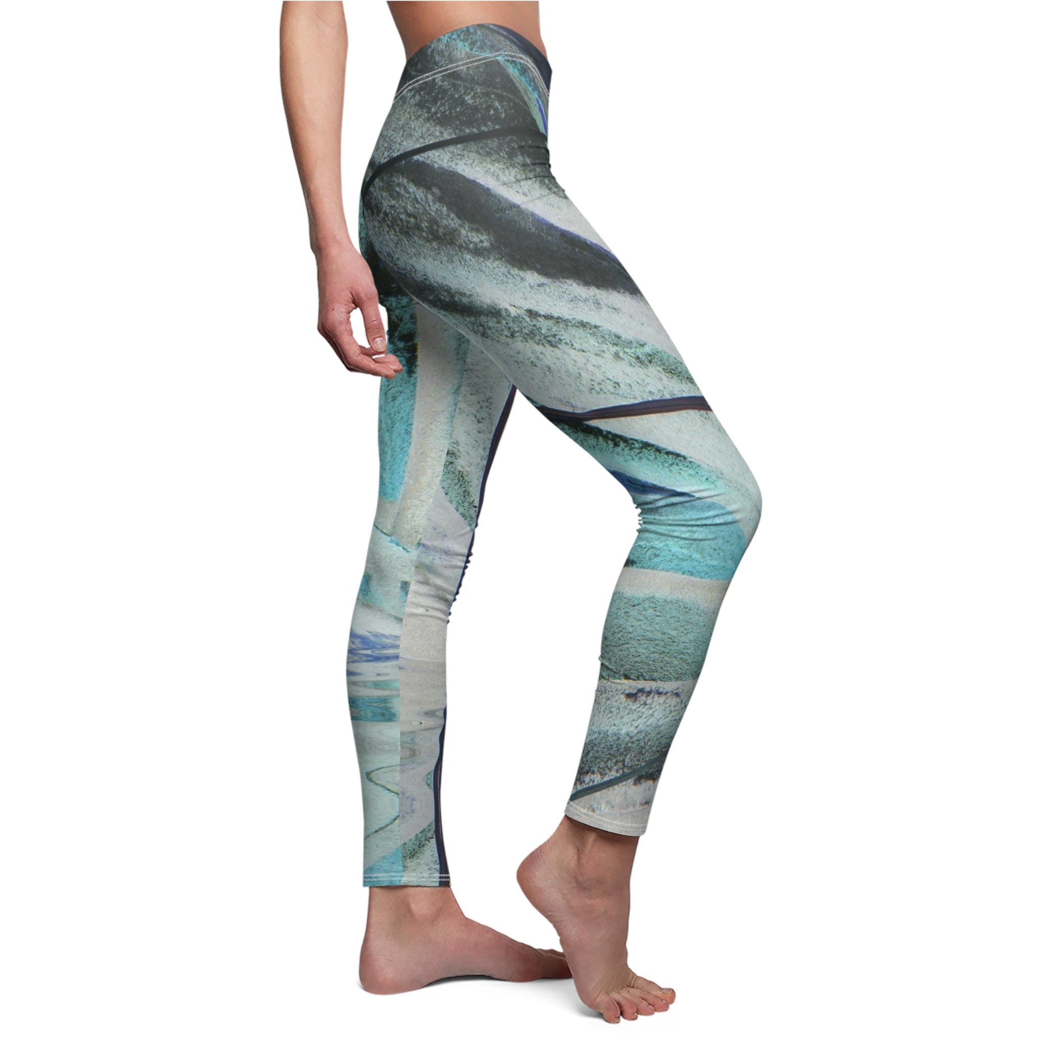 Leggings with a pattern of blue, green, and gray on a white background
