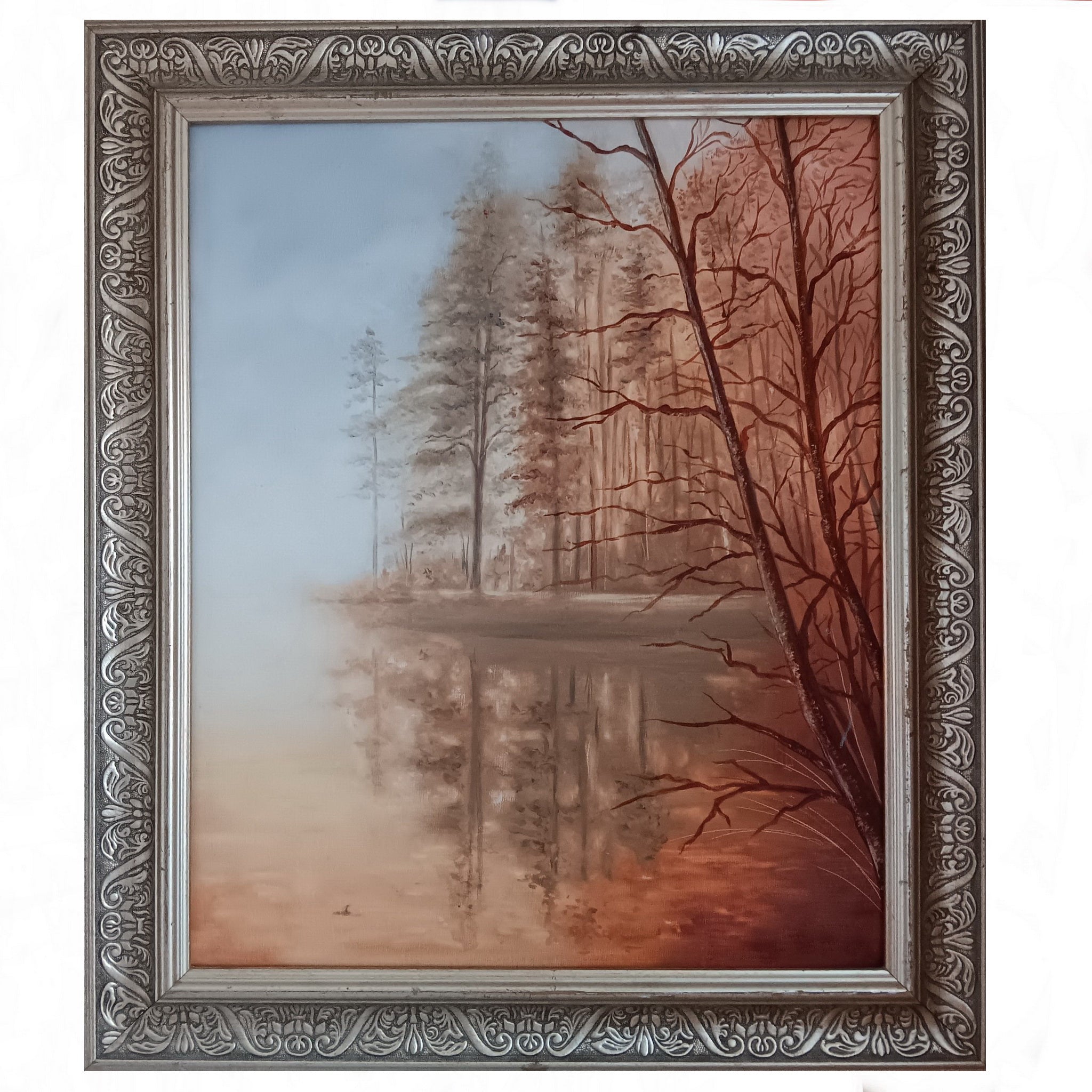 Framed artwork of a forest scene with trees reflected in water.