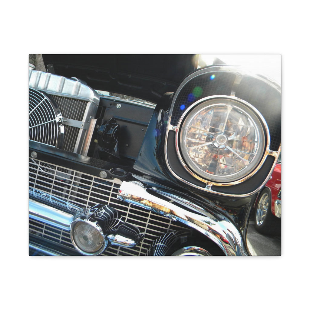 Close-up of a car's front grille and headlight on a white background