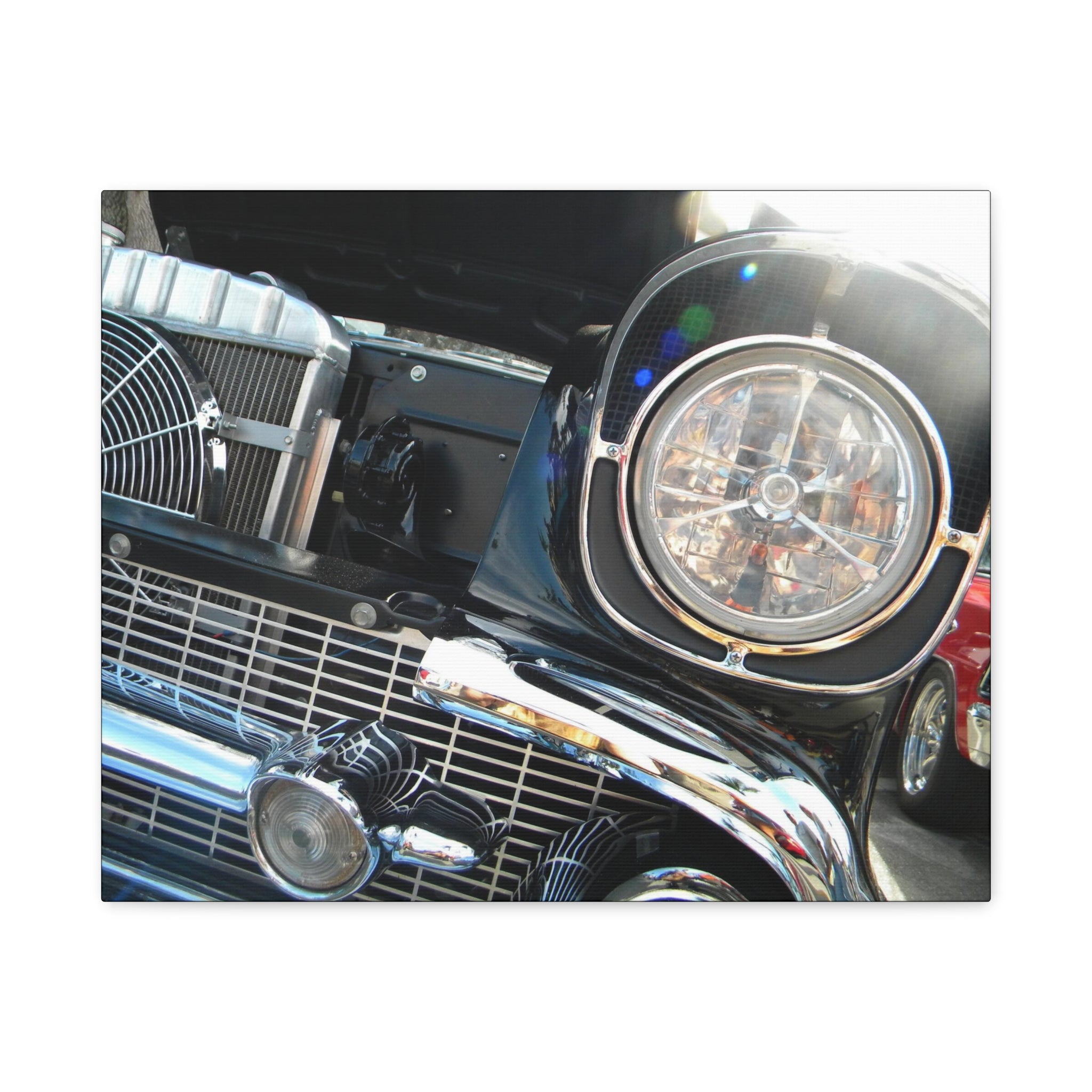 Close-up of a car's front grille and headlight on a white background