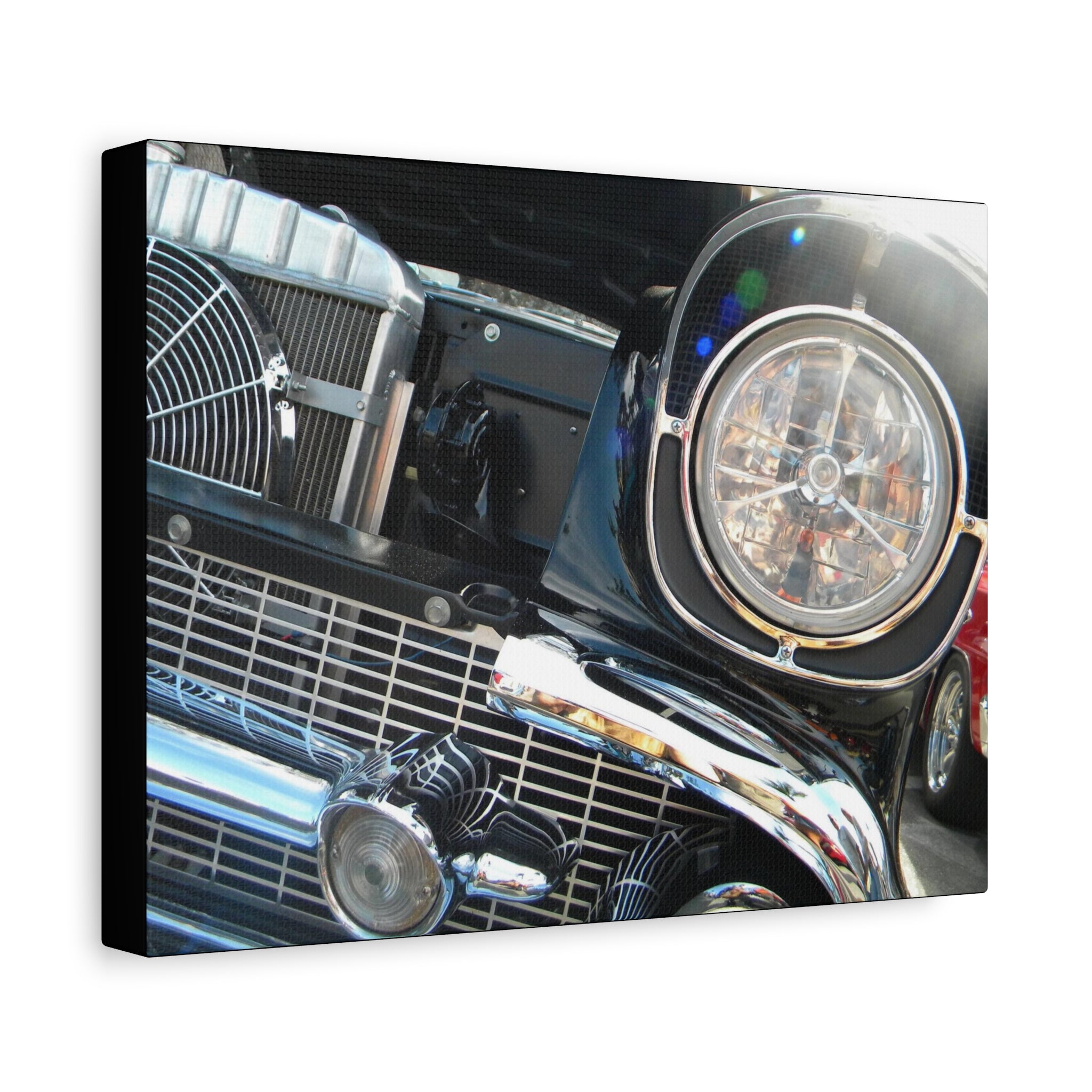 Close-up of a car's front grille and headlight on a white background