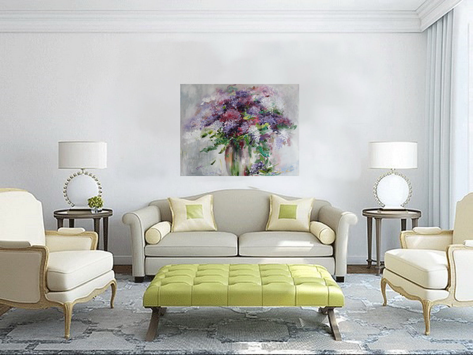 Modern living room with a gray sofa, green ottoman, and floral painting on the wall.