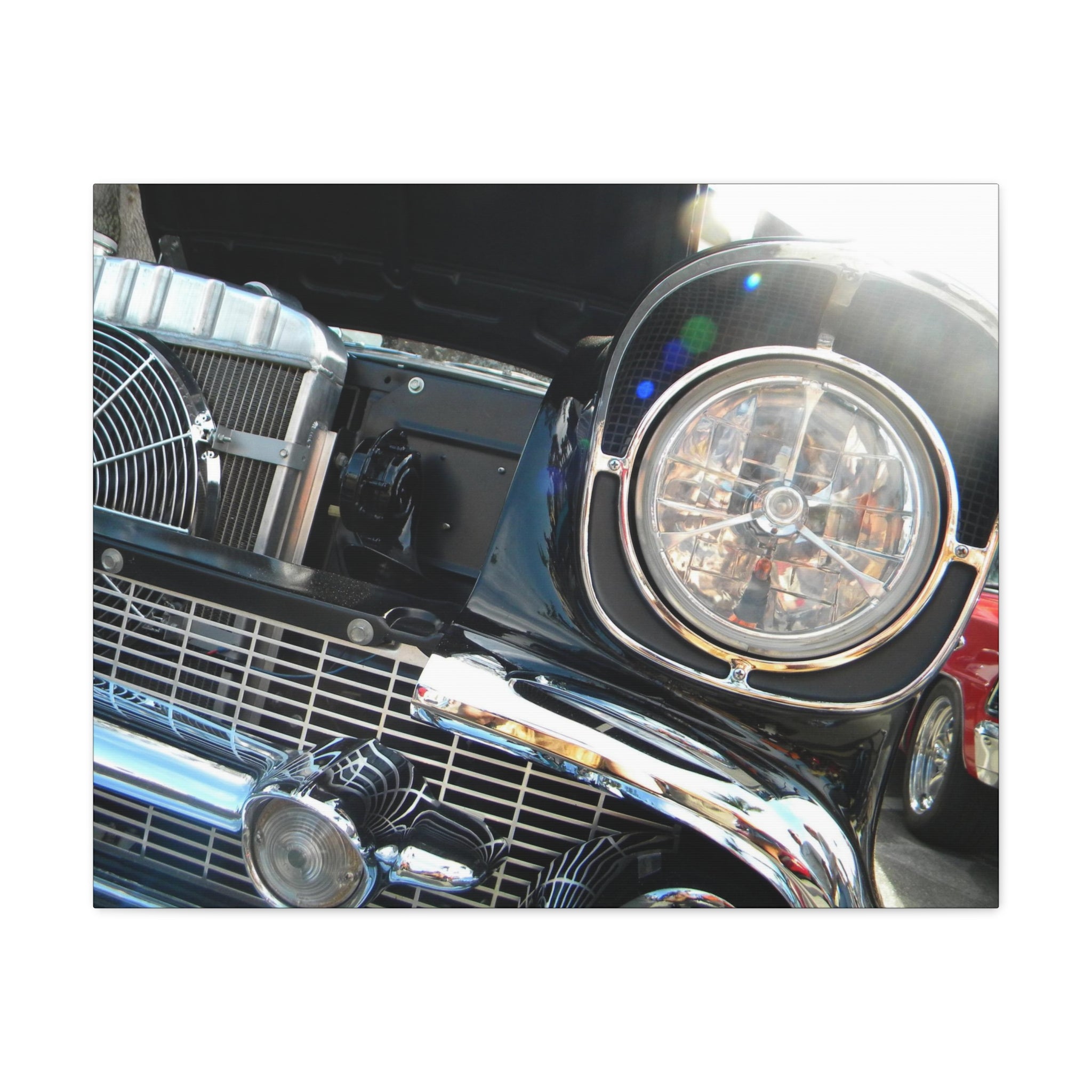 Close-up of a classic car's front grille and headlight