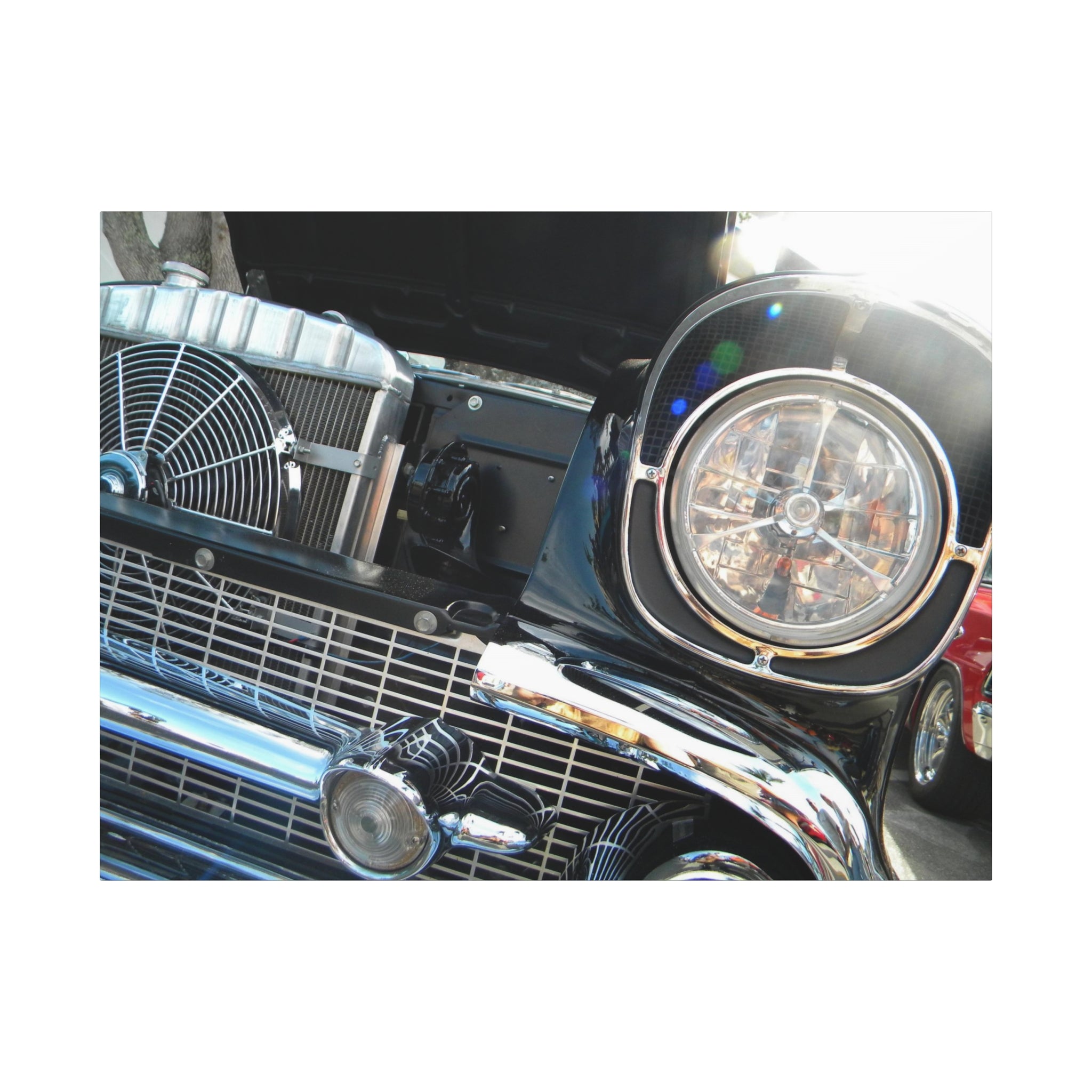 Close-up of a classic car's front grille and headlight