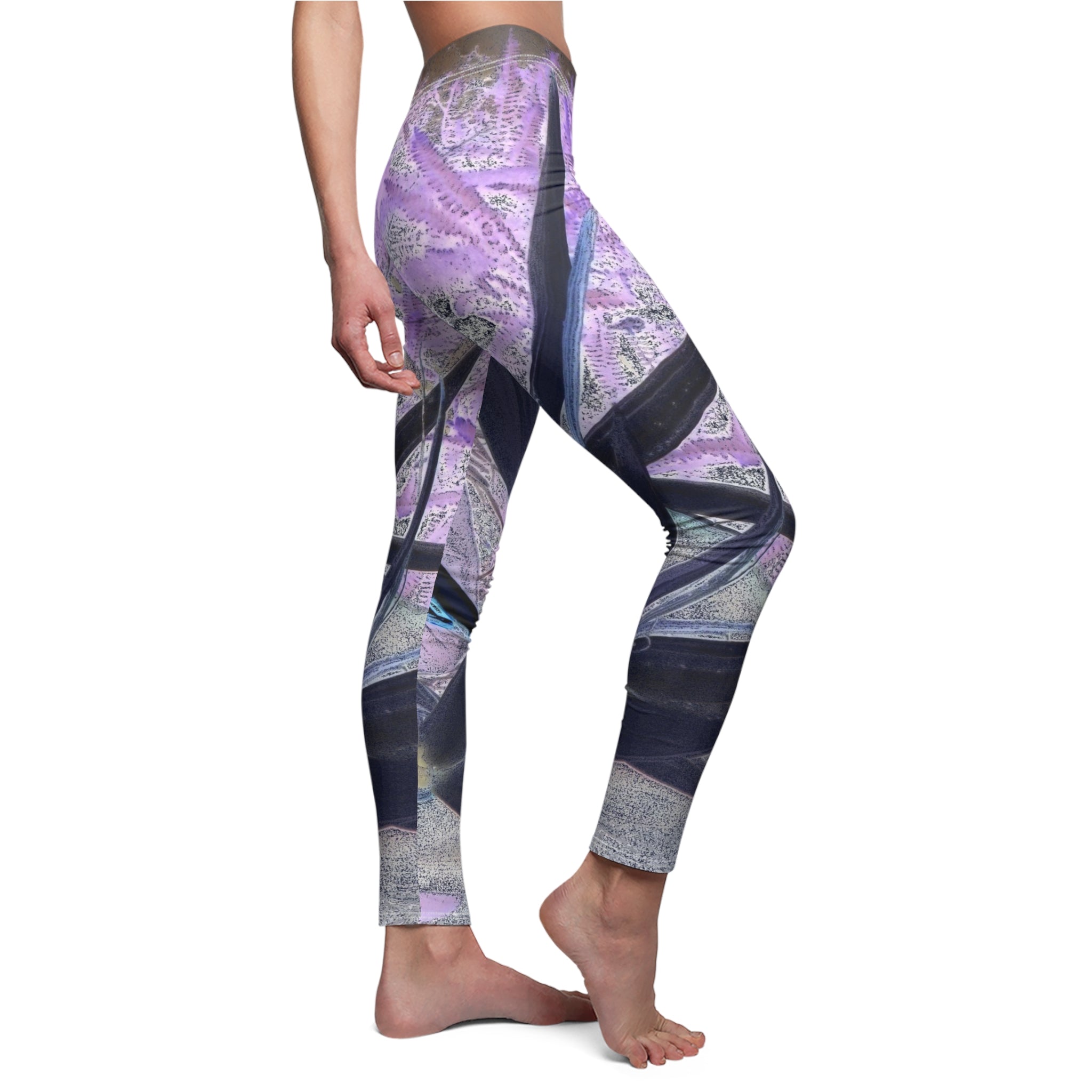 Purple and gray patterned leggings worn by a person on a white background