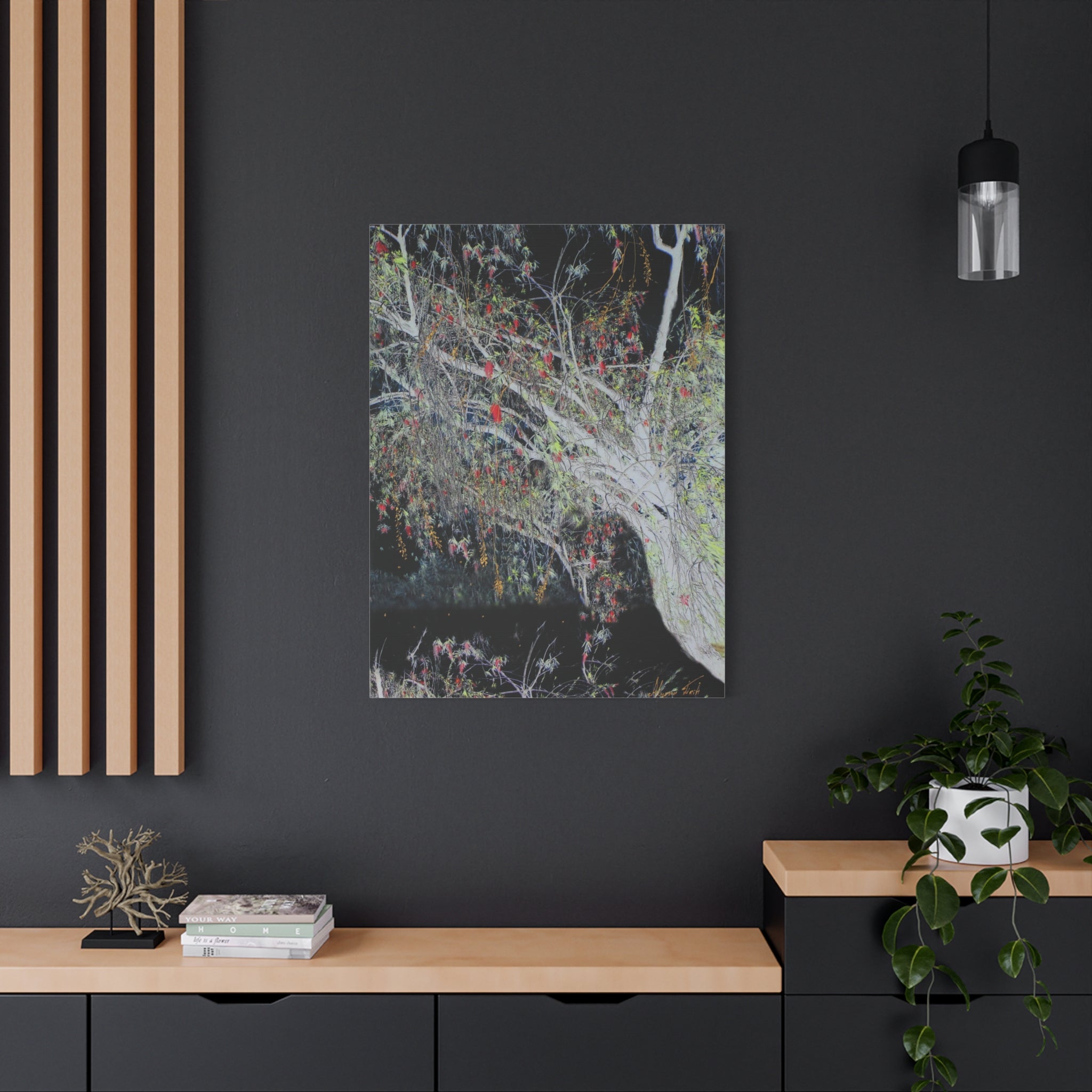 Artistic depiction of a tree with colorful leaves on a dark wall in a modern interior setting.