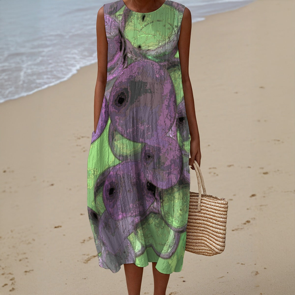 Person wearing a green and purple floral dress on a beach