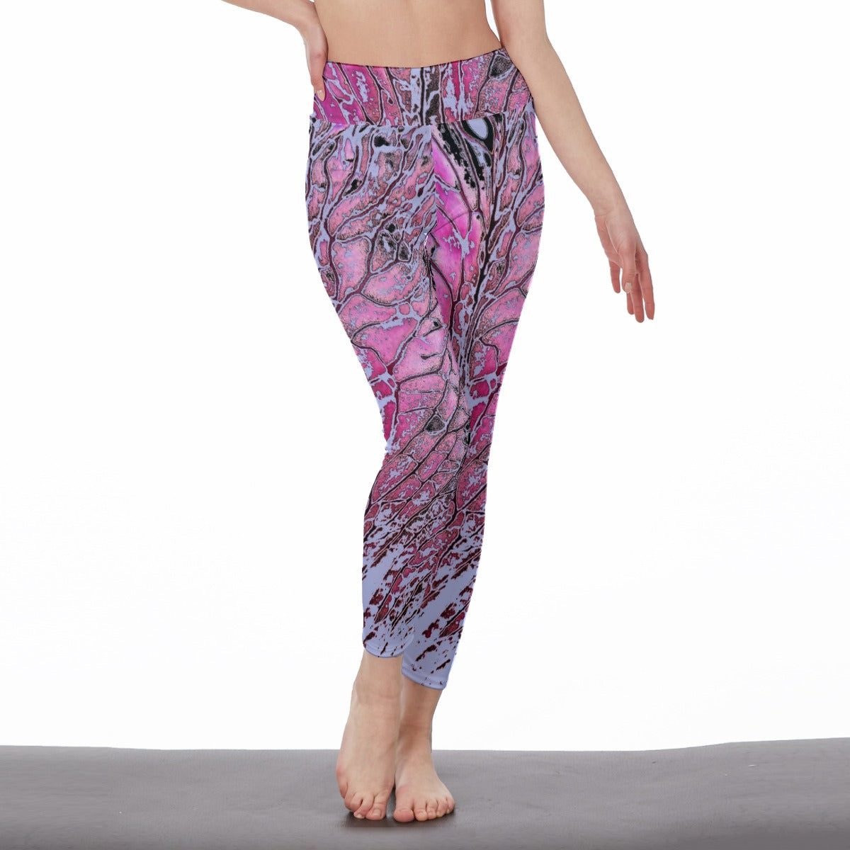 Pink and purple patterned leggings worn by a person on a white background