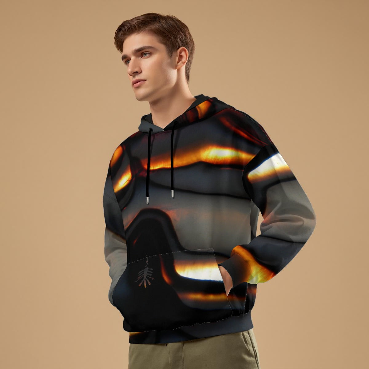 Man wearing a reflective hoodie with flame design on a beige background