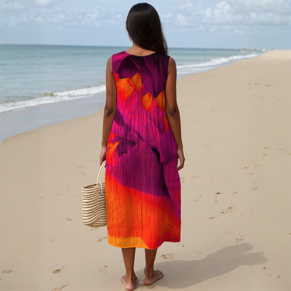 Woman in a colorful dress standing on a beach