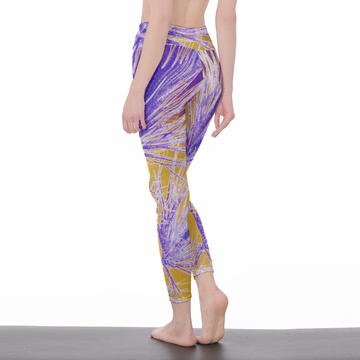 Person wearing purple and yellow patterned leggings on a white background