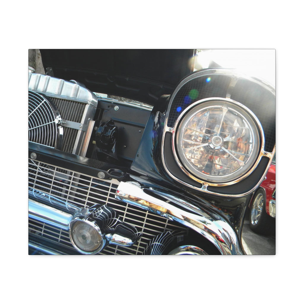 Close-up of a vintage car's front grille and headlight
