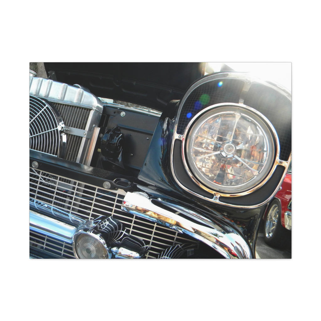 Close-up of a car's front grille and headlight on a white background