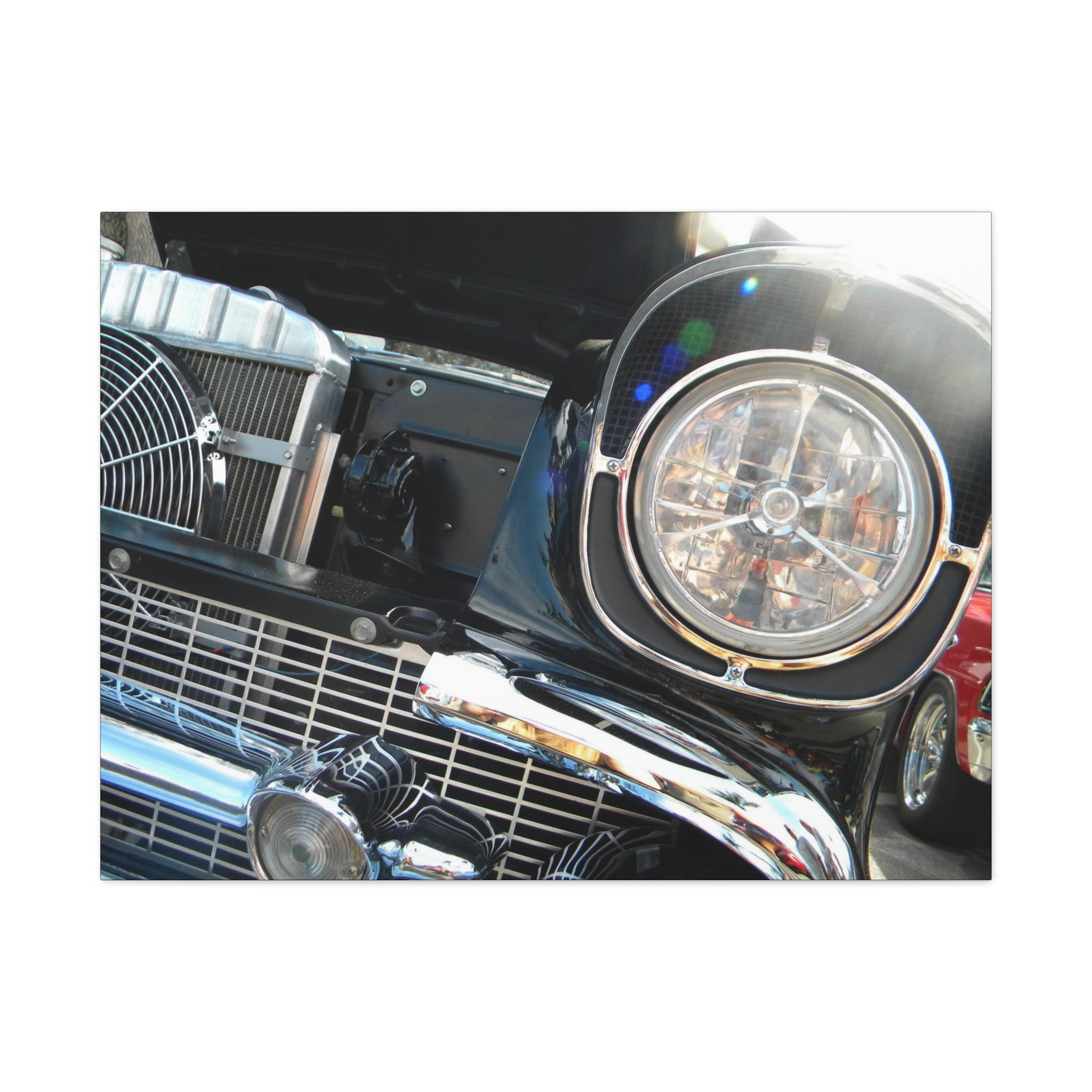 Close-up of a car's front grille and headlight on a white background