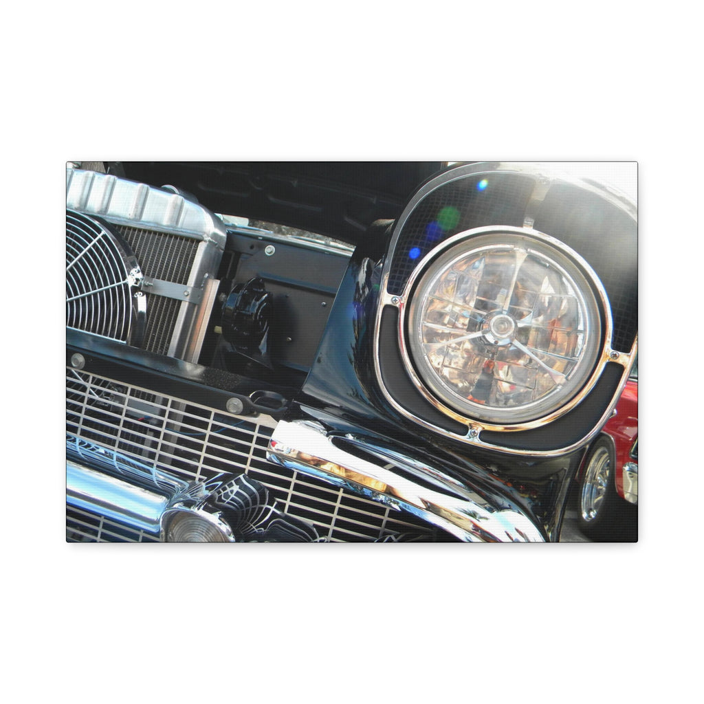 Close-up of a car's front grille and headlight on a white background