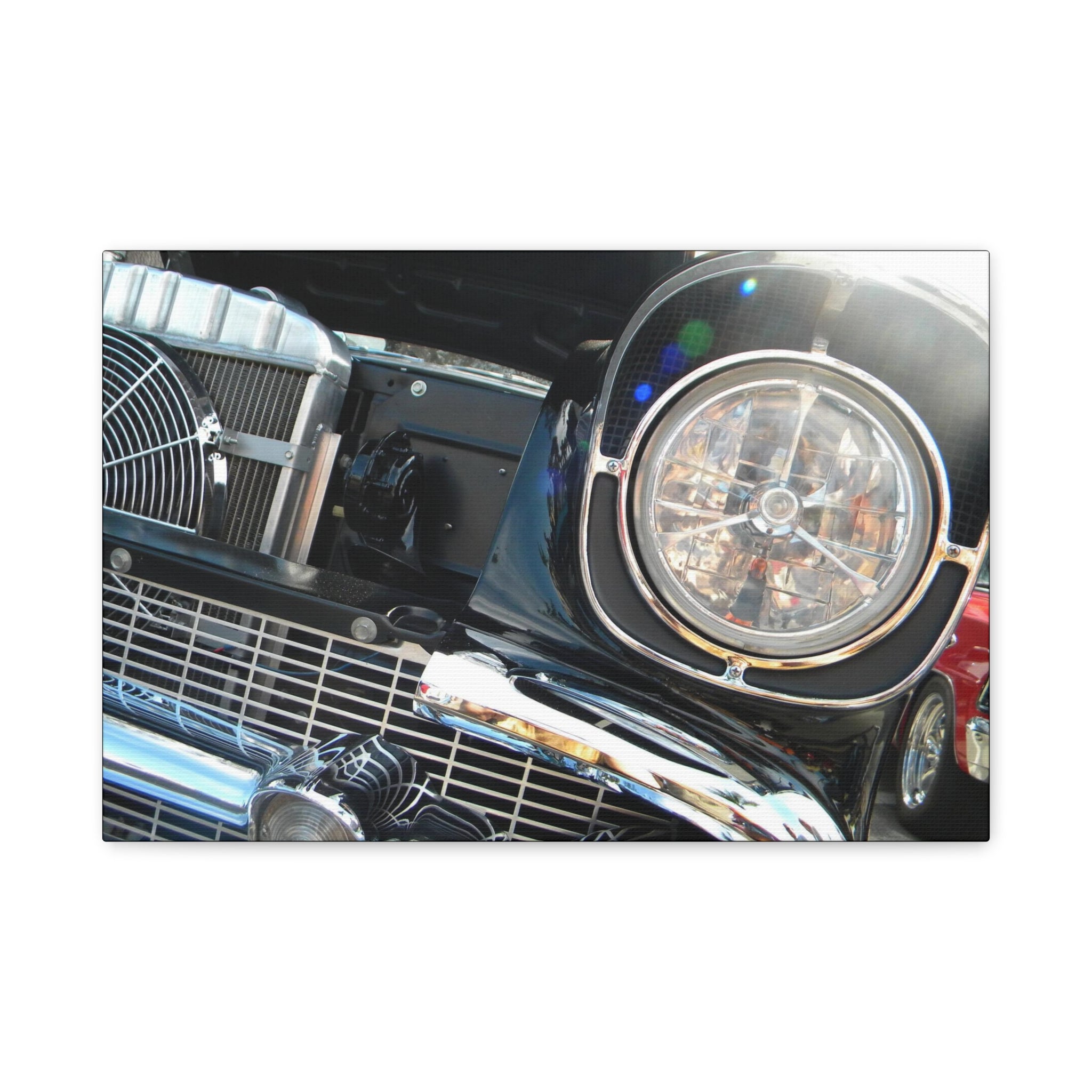 Close-up of a car's front grille and headlight on a white background