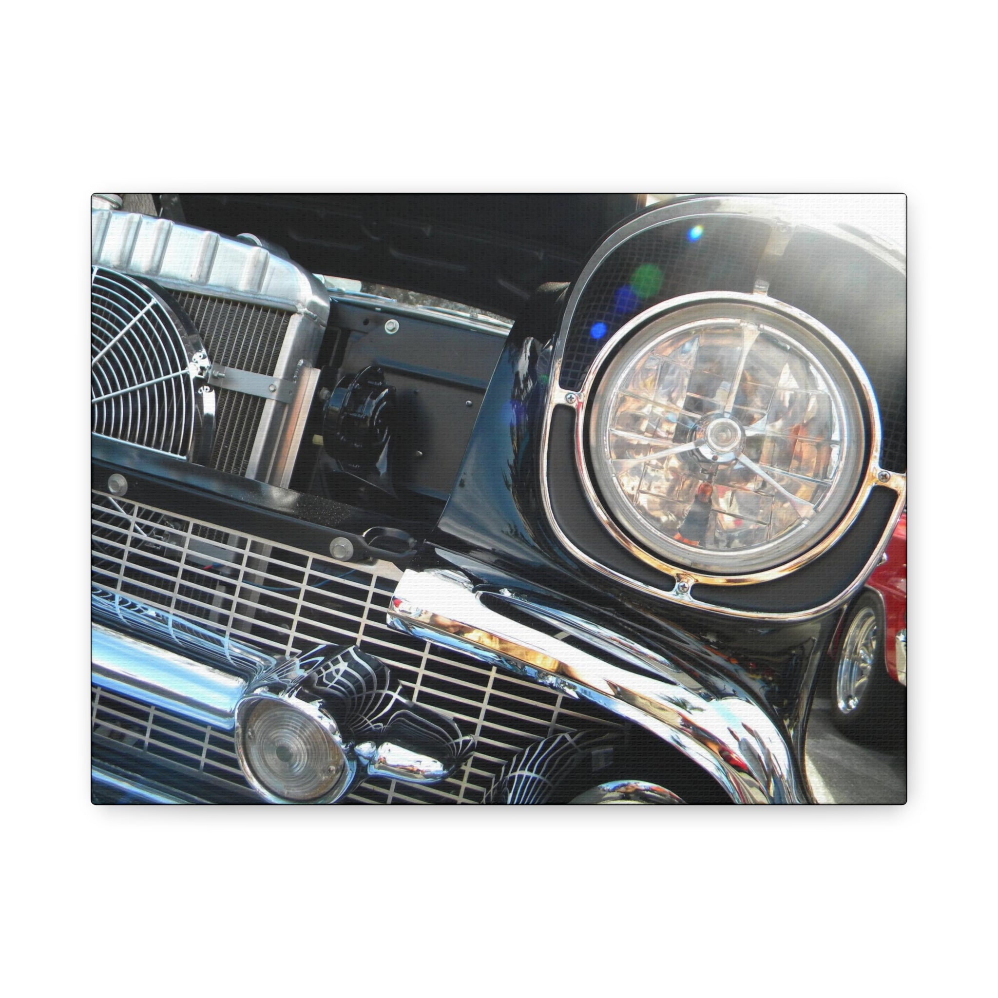 Close-up of a classic car's front grille and headlight