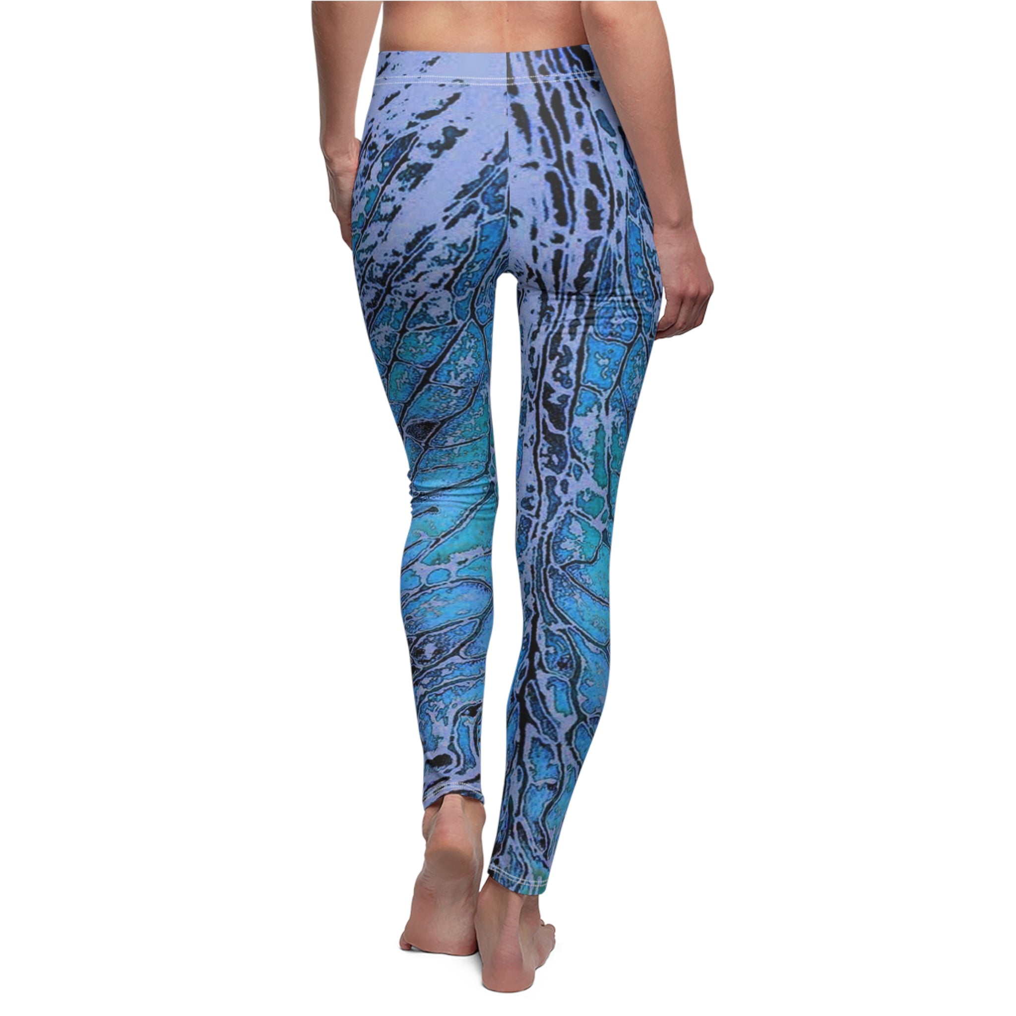 Blue patterned leggings worn by a person on a white background